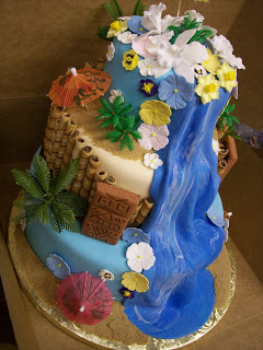 Luau Cake with Tiki totems and a Waterfall - Uniquely Grace Designs