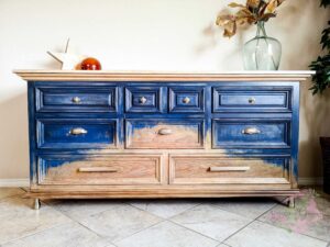 This image shows the final chalk paint finish with a modern rustic style. It is finished in raw wood, navy chalk paint and antique golden brass pulls and knobs.